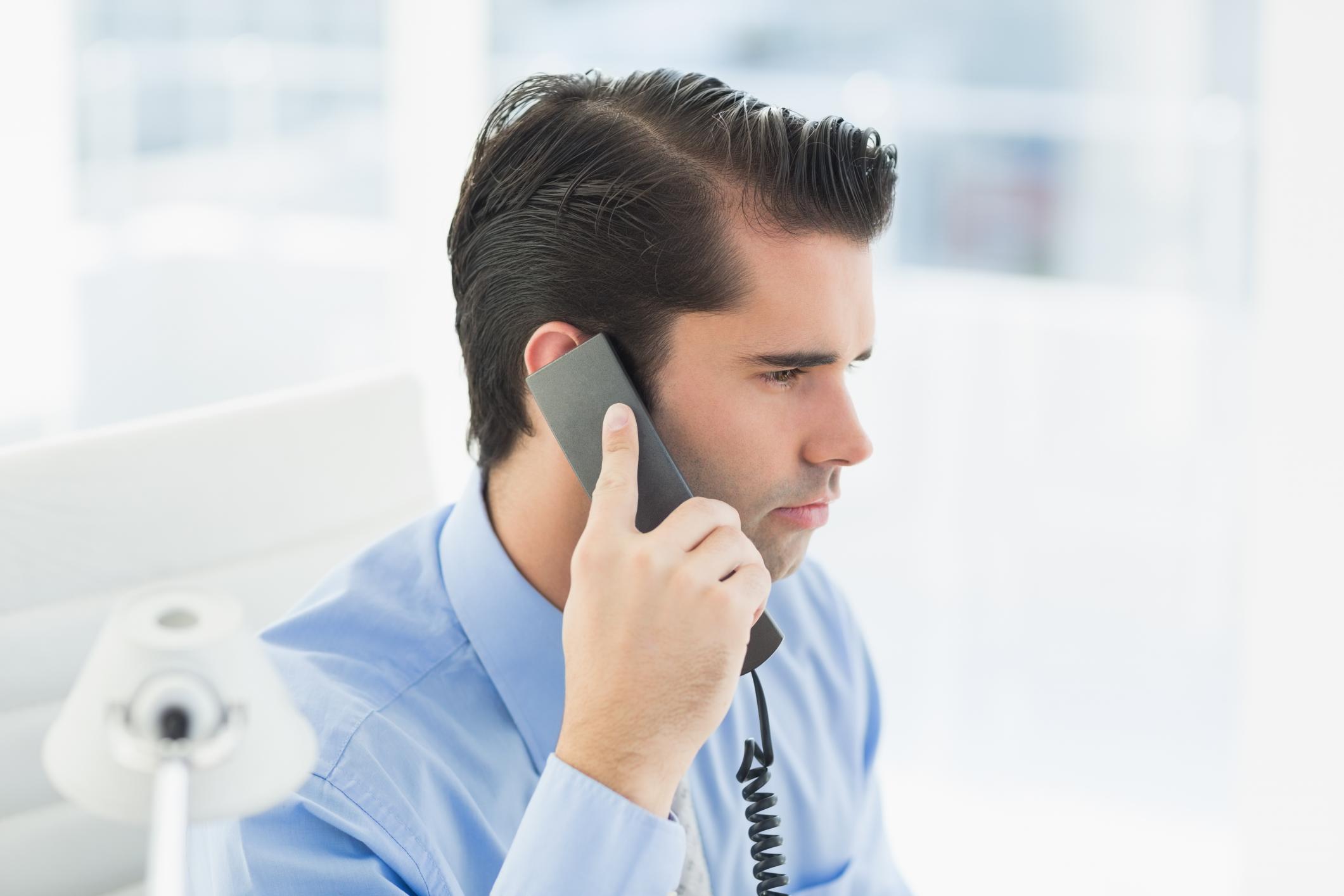 man talking on the telephone